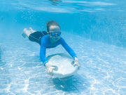 The green Asiwo Mako Electric Kickboard is in action, being held by a child swimming underwater.